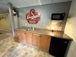 Lower level wetbar with mini fridge/sink/micro
